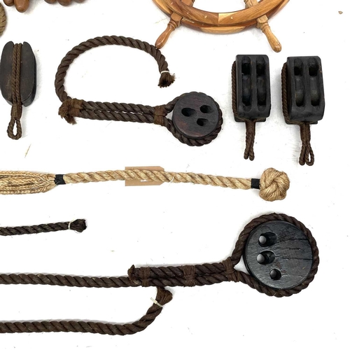 34 - A large collection of reproduction maritime items Including cat 'o' nine tails, rope, block and tack... 