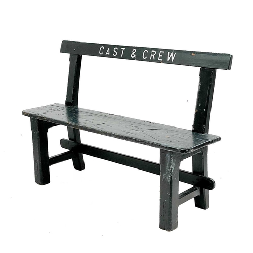 350 - A painted wood bench. CAST and CREW, height 85cm width 123cm.