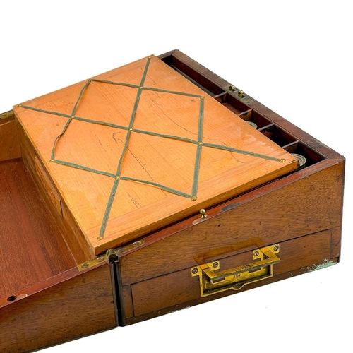 36 - A 19th century mahogany writing box. With brass stringing and inlay, the interior fitted compartment... 