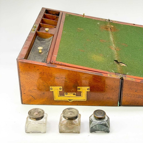 36 - A 19th century mahogany writing box. With brass stringing and inlay, the interior fitted compartment... 