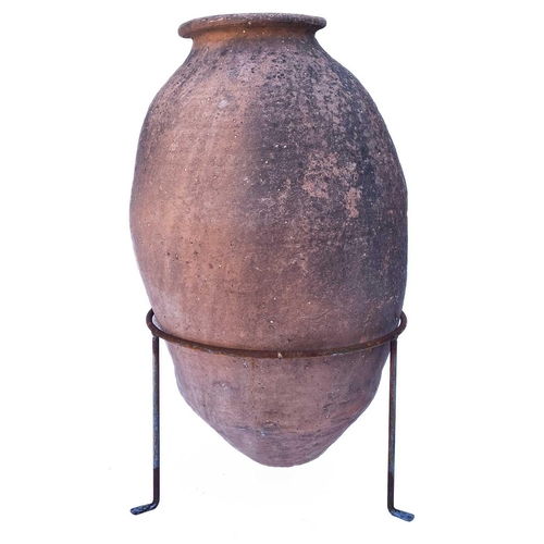 368 - A terracotta olive jar. With a wire tripod stand, overall height 72cm.