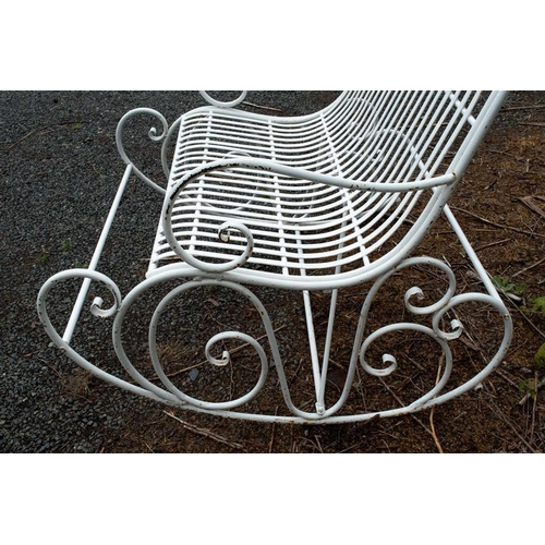 369 - A wrought iron two seater garden rocking chair. With scroll work decoration, height 114cm width 11cm... 