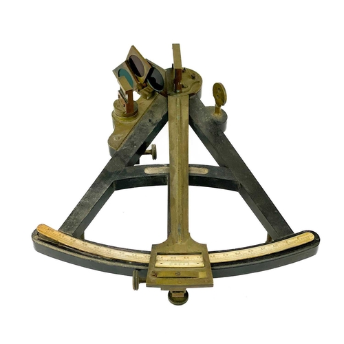 37 - A brass and ebony octant. Early 19th century, contained in an oak case, height 36cm. Ivory exemption... 