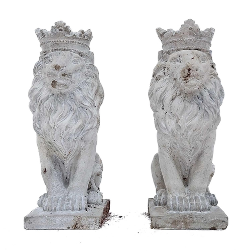 375 - A pair of reconstituted stone lions. Height 35cm, depth 18.5cm, width 13cm.