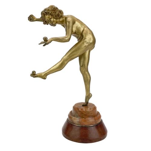 39 - Claire Jean Roberte Colinet (Belgium 1880-1950). An Art Deco gilt bronze figure of a juggler on marb... 