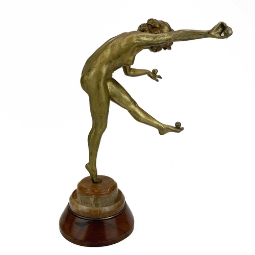 39 - Claire Jean Roberte Colinet (Belgium 1880-1950). An Art Deco gilt bronze figure of a juggler on marb... 