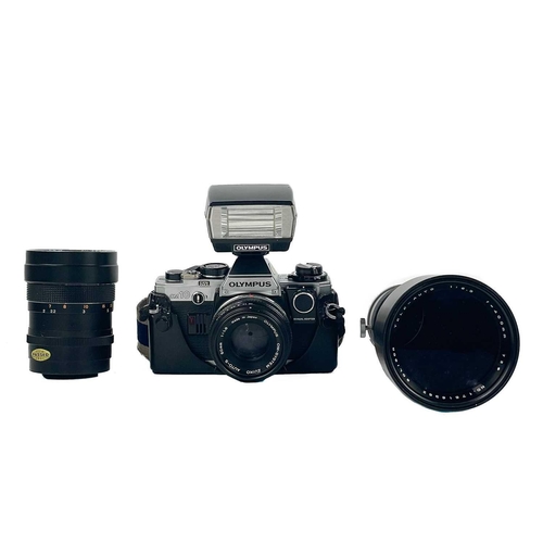 40 - An Olympus OM10 SLR camera, Fitted with a Zuiko Auto-S 50mm lens, boxed with accessories and manual,... 