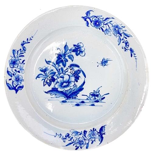 410 - A Lowestoft plate with blue and white floral and insect decoration. Diameter 22cm, together with a L... 