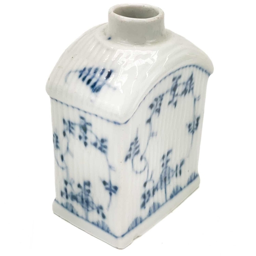 412 - A German soft paste porcelain tea caddy. Circa 1800, blue and white decorated with simple foliates o... 