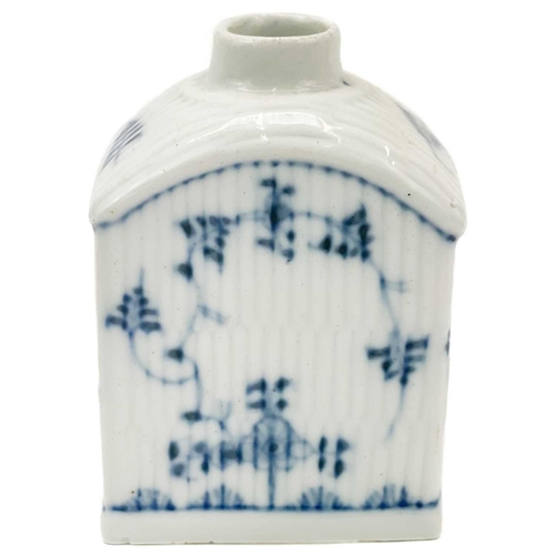 412 - A German soft paste porcelain tea caddy. Circa 1800, blue and white decorated with simple foliates o... 