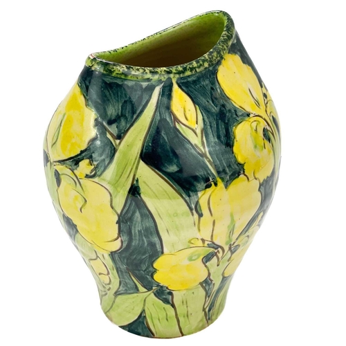 414 - Paul Jackson (1954) Ceramic vase decorated with yellow iris, height 15cm.