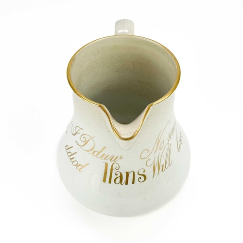 423 - A rare documentary temperance pearlware jug. Circa 1860, inscribed in gilt with the name Ifans and N... 