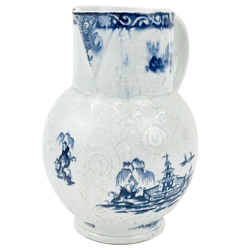 431 - A large Lowestoft blue and white floral moulded jug. Decorated with a pagoda in a landscape, 2 mark ... 