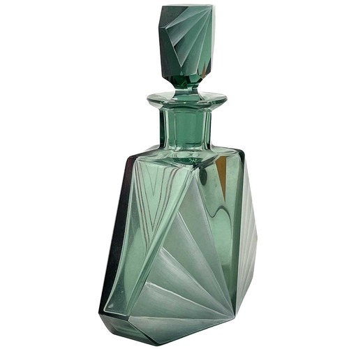 447 - An Art Deco green glass decanter and stopper. Of angular form, with white, red and gilt painted deco... 