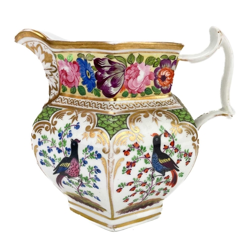 453 - A 19th century French porcelain jug. Painted with panels of exotic birds and flowers, height 16cm, t... 