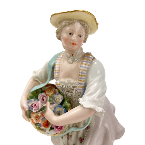 463 - A pair of Meissen figures of flower sellers. Late 19th century, each in 18th century costume, on cir... 