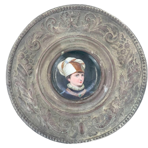 464 - A German porcelain portrait saucer in a wide copper frame. Diameter 32cm, together with a Continenta... 