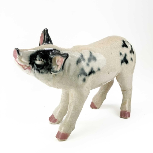 488 - A studio type large crackle glazed figure of a pig. With black and white markings, height 37cm, leng... 