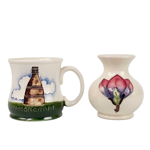 495 - A Moorcroft pottery mug, a vase and two dishes. The mug dated 1986, height 9cm, the vase tube-lined ... 