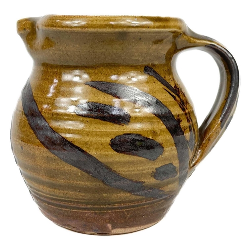 511 - A collection of Seth Cardew studio pottery. To include a teapot 14 cm high, three small cream jugs 8... 