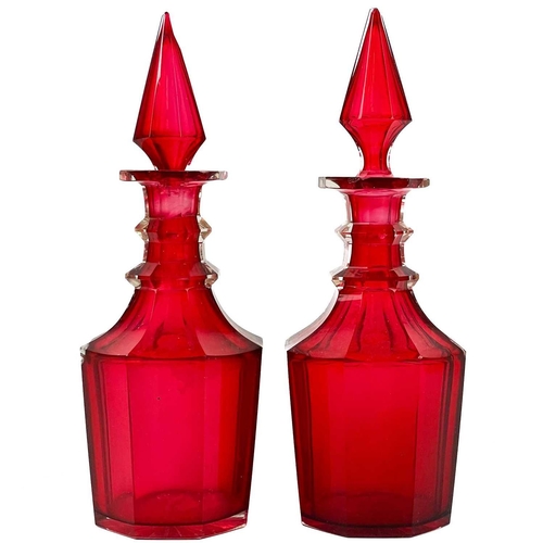 516 - A pair of 19th century cranberry glass decanters and stoppers. Height 27cm, together six various rum... 