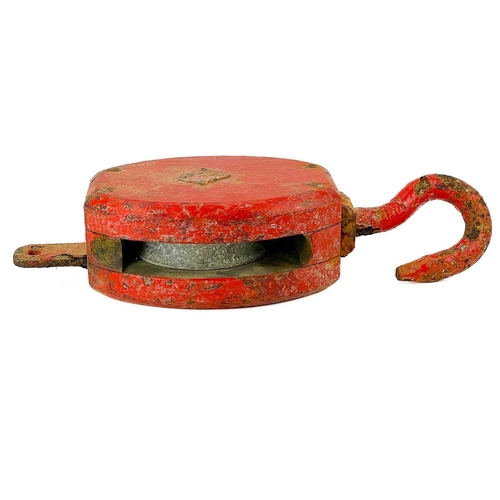 52 - A red painted ship's block and hook. Height 40cm.