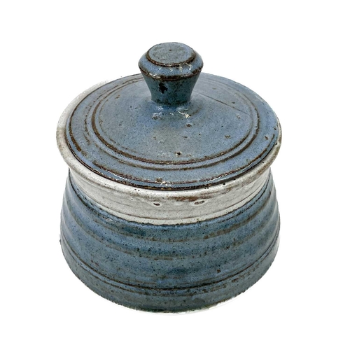 527 - A Peter Arnold studio pottery coffee can, impressed marks. Height 9cm Together with a studio pottery... 