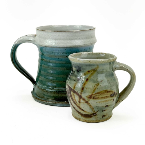 527 - A Peter Arnold studio pottery coffee can, impressed marks. Height 9cm Together with a studio pottery... 