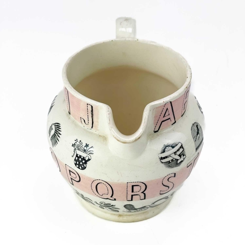 528 - A Wedgwood alphabet jug, by Eric Ravilious. Decorated with bands of pink, height 10.5cm. There is a ... 