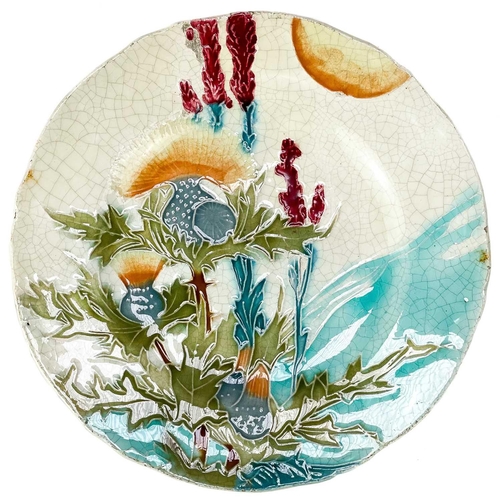 535 - A Minton secessionist plate. The turquoise ground with tube-lined floral decoration, printed mark, d... 