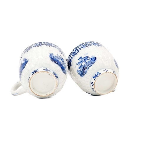 537 - A pair of 18th century moulded teacups. Probably Bow blue and white decorated with Oriental and Euro... 