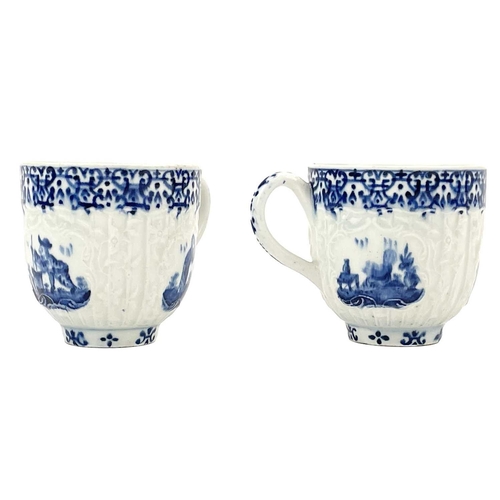 537 - A pair of 18th century moulded teacups. Probably Bow blue and white decorated with Oriental and Euro... 