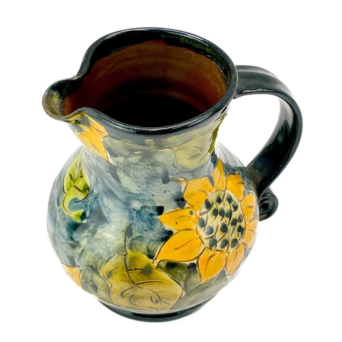 548 - Paul Jackson (1954) Ceramic jug decorated with sunflowers, height 14cm together with another two Pau... 