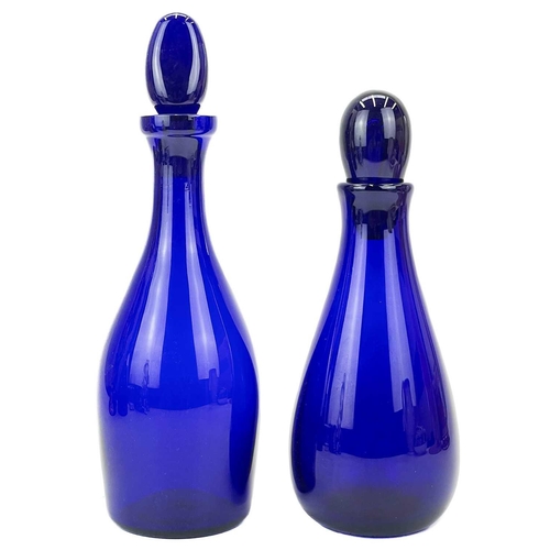 552 - A modern Bristol blue glass decanter and stopper. Signed to base, together with another Bristol blue... 