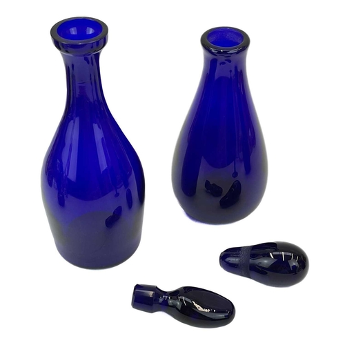 552 - A modern Bristol blue glass decanter and stopper. Signed to base, together with another Bristol blue... 