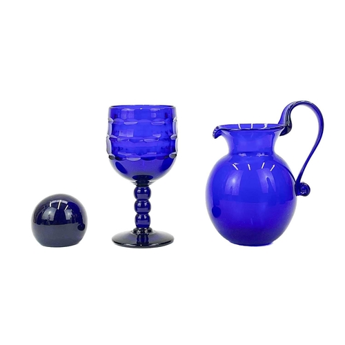 552 - A modern Bristol blue glass decanter and stopper. Signed to base, together with another Bristol blue... 