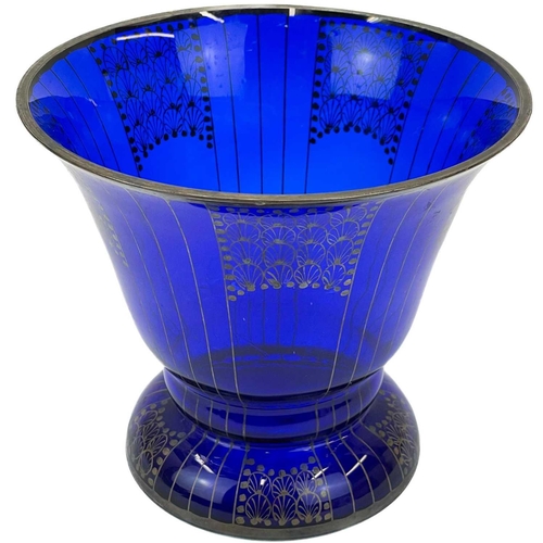 554 - An Austrian blue glass vase with secessionist style gilt decoration. Cira 1930, height 14.5cm.