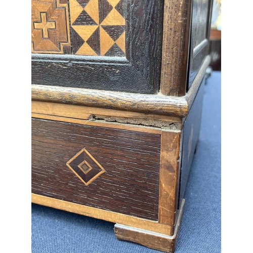 56 - An Italian walnut, rosewood and parquetry inlaid cigar dispenser. With four opening doors each with ... 