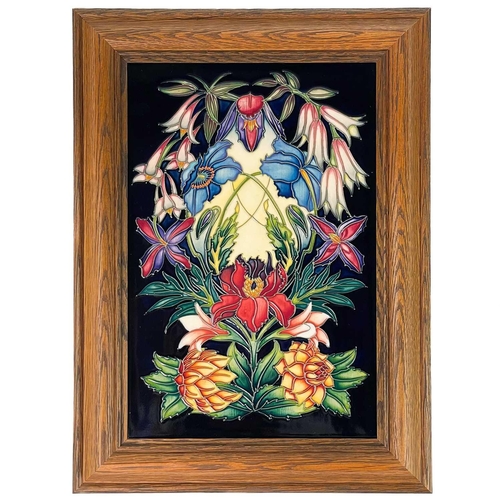 563 - A Moorcroft limited edition framed plaque. Tube lined with floral decoration by Philip Gibson, numbe... 