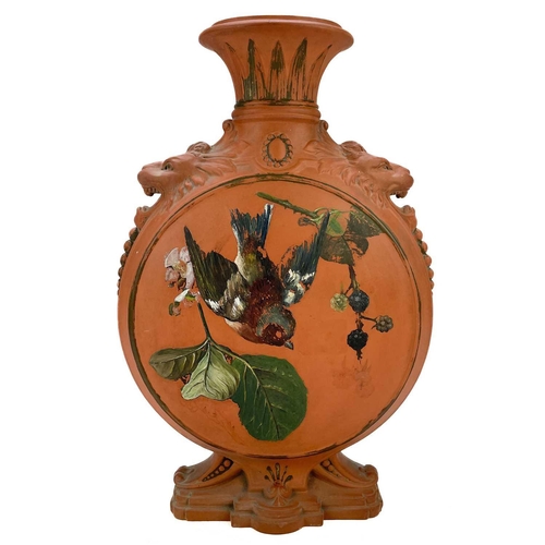 578 - A Victorian Watcombe terracotta pottery moon flask. With lion mask shoulders and painted with a chaf... 