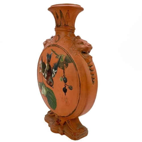 578 - A Victorian Watcombe terracotta pottery moon flask. With lion mask shoulders and painted with a chaf... 