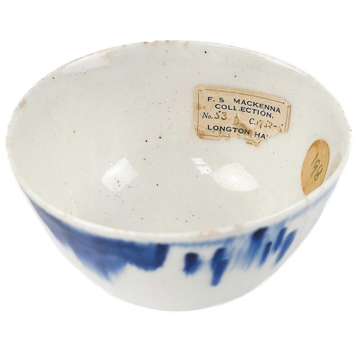 583 - A very early English porcelain tea bowl. Circa 1750, underglaze blue painted with a floral border, w... 