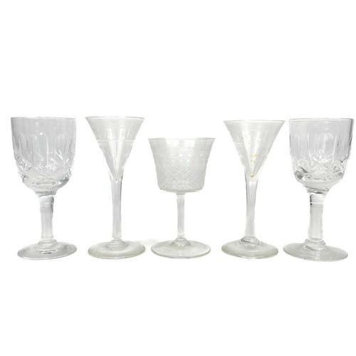 589 - A set of three cut glass decanters and faceted stoppers. One with a silver Whisky label, together wi... 