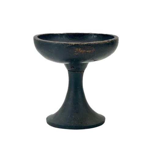 59 - An African tribal stem footed bowl. With a plain dished top on a hollow outward tapering stem, heigh... 