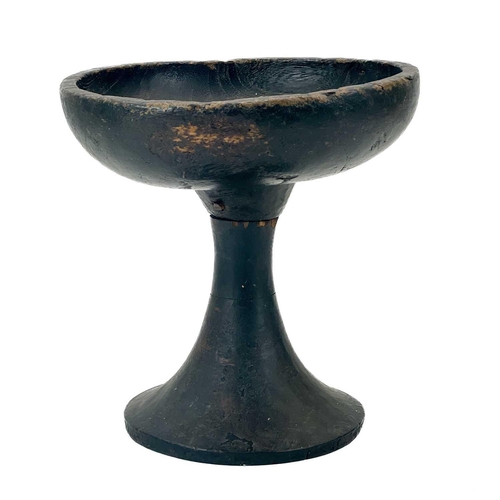 59 - An African tribal stem footed bowl. With a plain dished top on a hollow outward tapering stem, heigh... 