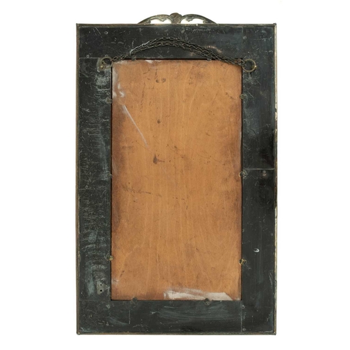 602 - An Edwardian brass framed rectangular wall mirror. With leafy scroll and floral swag surmount, and f... 