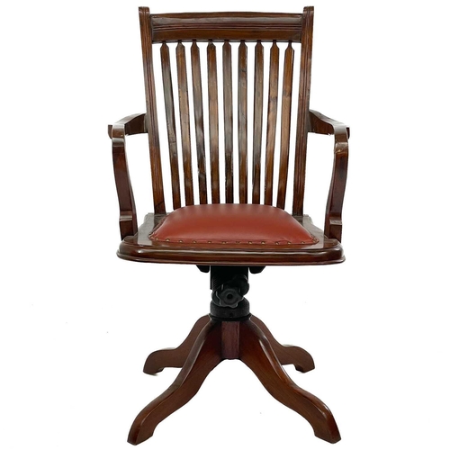 603 - A teak swivel office chair. Mid 20th century, with slat back and padded seat, height 102cm, width 60... 