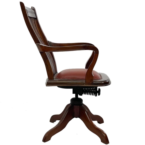 603 - A teak swivel office chair. Mid 20th century, with slat back and padded seat, height 102cm, width 60... 