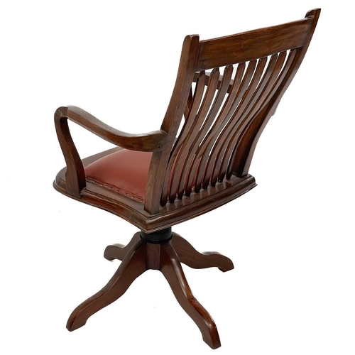 603 - A teak swivel office chair. Mid 20th century, with slat back and padded seat, height 102cm, width 60... 