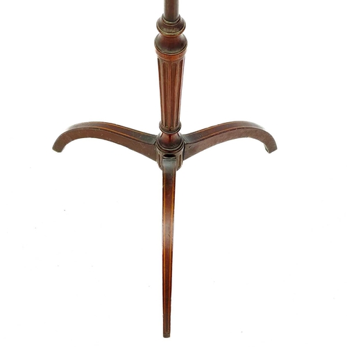 611 - A Regency mahogany pole screen base. With an inlaid tripod base and fluted column and a later torche... 